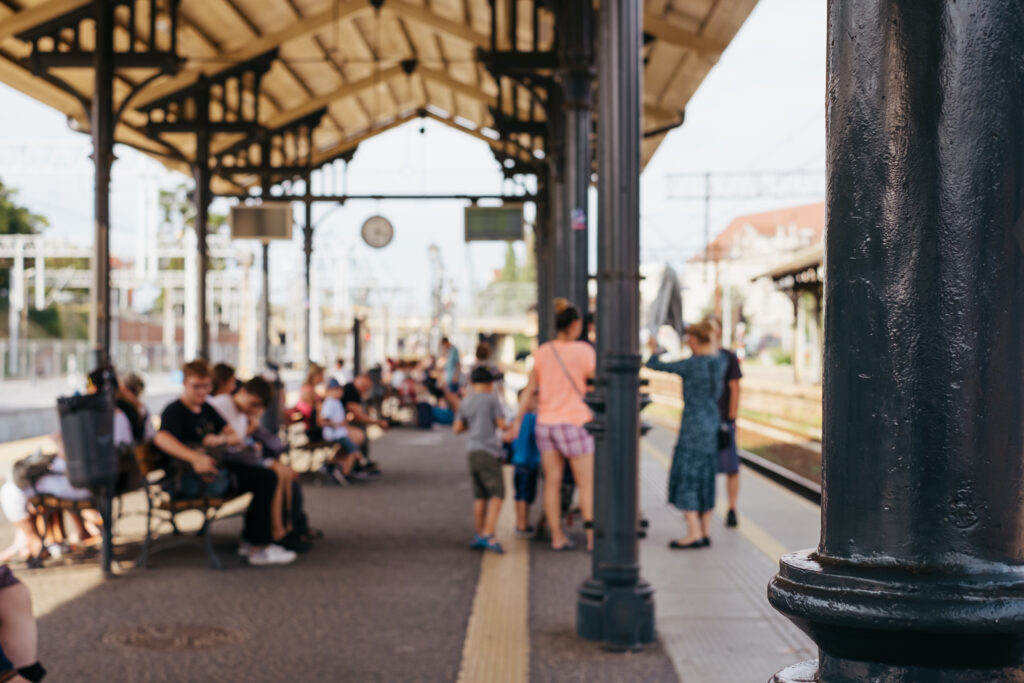 People waiting for a train at a railway station - free stock photo