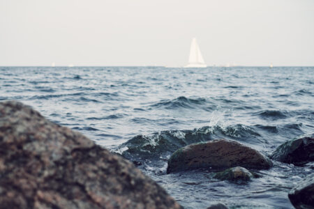 Small waves hitting rocks at the sea - free stock photo